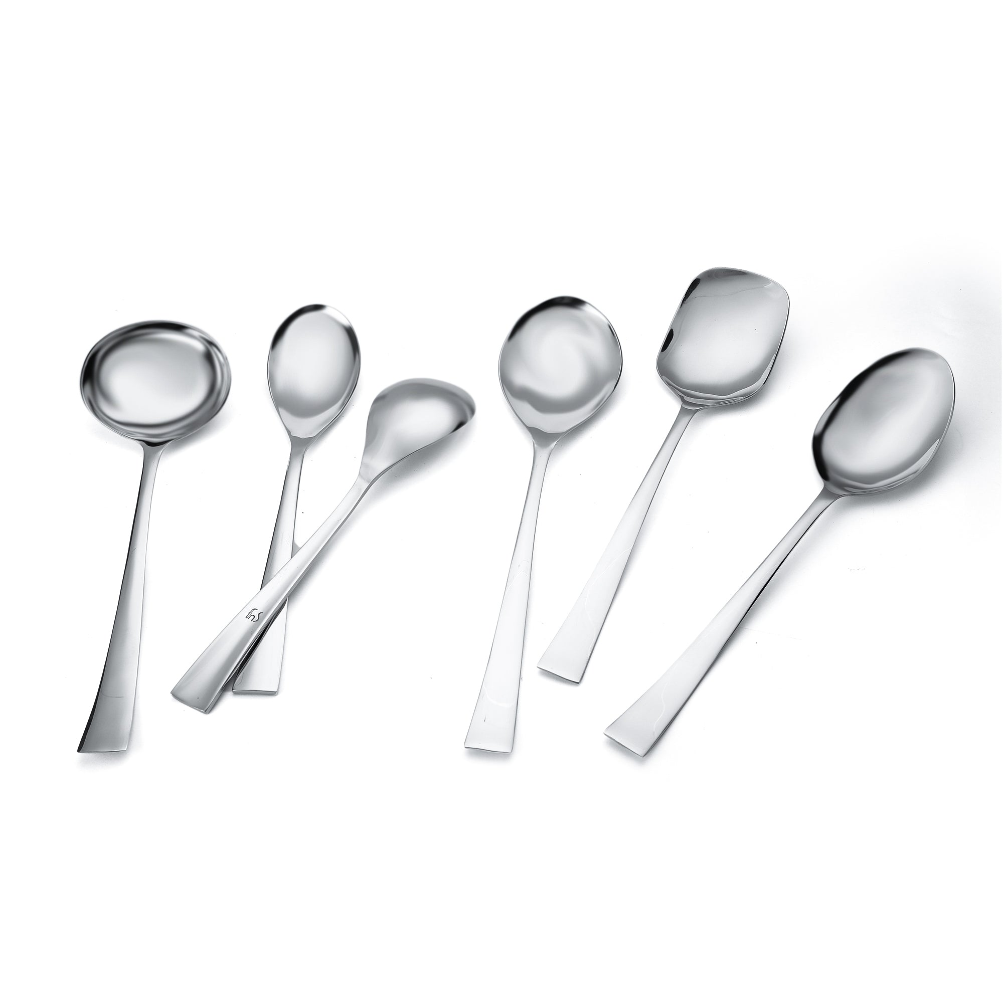 FNS Slim Line serving spoon set artistically arranged showing gravy ladle, rice server, and serving spoons with elegant slim handles and mirror polish finish.