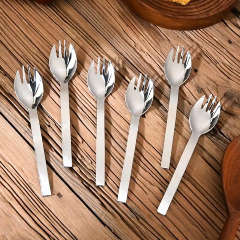FNS Solo 6-piece stainless steel spork set with mirror finish displayed on rustic wooden table, ideal for modern dining and everyday use.