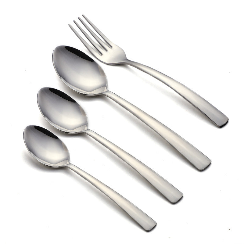 Set of fork and three spoons with smooth, curved handles laid flat on white background.