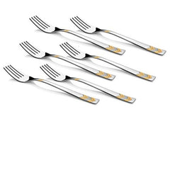 Six silver dinner forks with gold decorative patterns scattered on white background