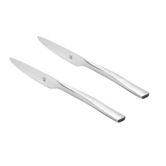 Pair of modern stainless steel dinner knives with minimalist flat handles and branded logo, displayed diagonally on white background.