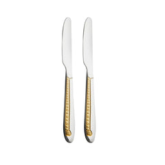 Pair of premium stainless steel dinner knives featuring ornate 24-karat gold plated handles with decorative pattern, displayed vertically on white.