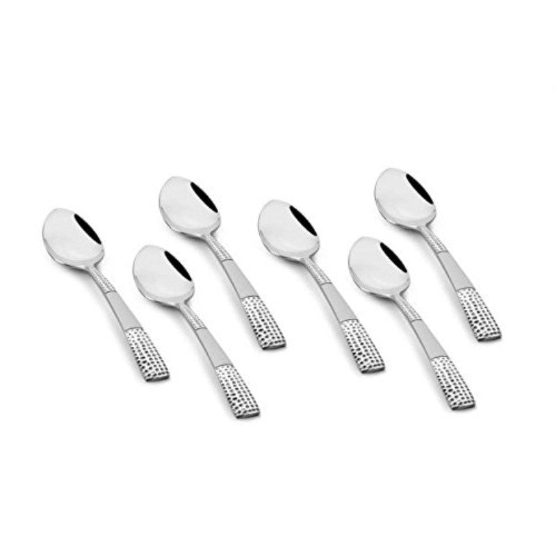 FNS Zest 6-piece stainless steel dinner spoon set arranged artistically, featuring textured grip handles and mirror polish finish for premium dining experience.