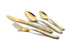 Golden knife, fork, and two spoons from FNS Victoria cutlery set shown on white background.