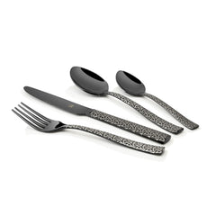 Black cutlery set with etched handles displayed diagonally on white background, highlighting sleek, modern design.