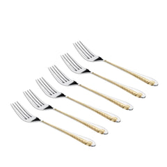 Six stainless steel forks with gold decorative handle pattern arranged diagonally on white background