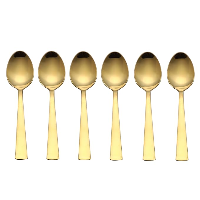 Gold dessert spoon set of 6 pieces with mirror finish and flat tapered handles in straight row on white background