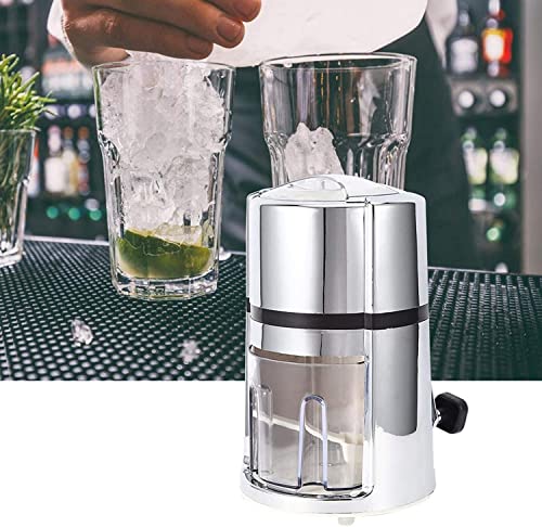 Bartender using hand crank ice crusher to make mojito at bar with garnished cocktail glasses