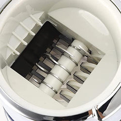 Top view of ice crusher internal mechanism showing crushing blades and spiral shaft system