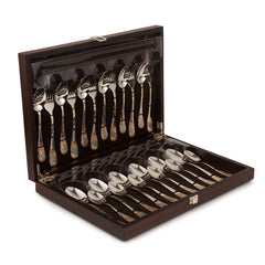 Luxury 24-piece cutlery set with gold-patterned handles, neatly stored in an elegant wooden presentation box.