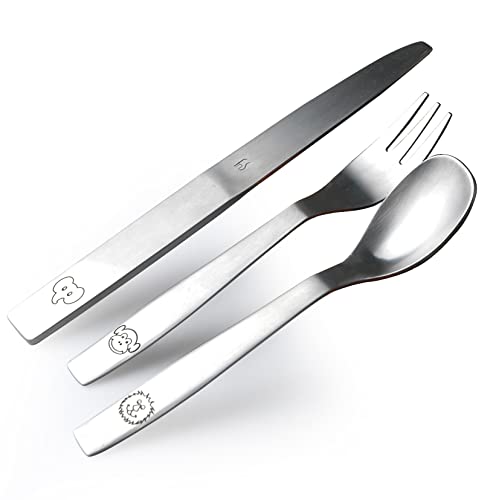 Fun animal-engraved spoon, fork, and knife set arranged diagonally on bright white background.