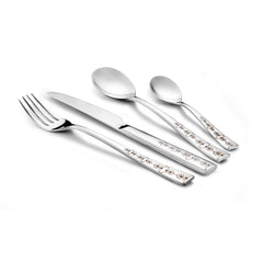 Four-piece stainless steel cutlery set with floral-etched handles laid out on a white background.