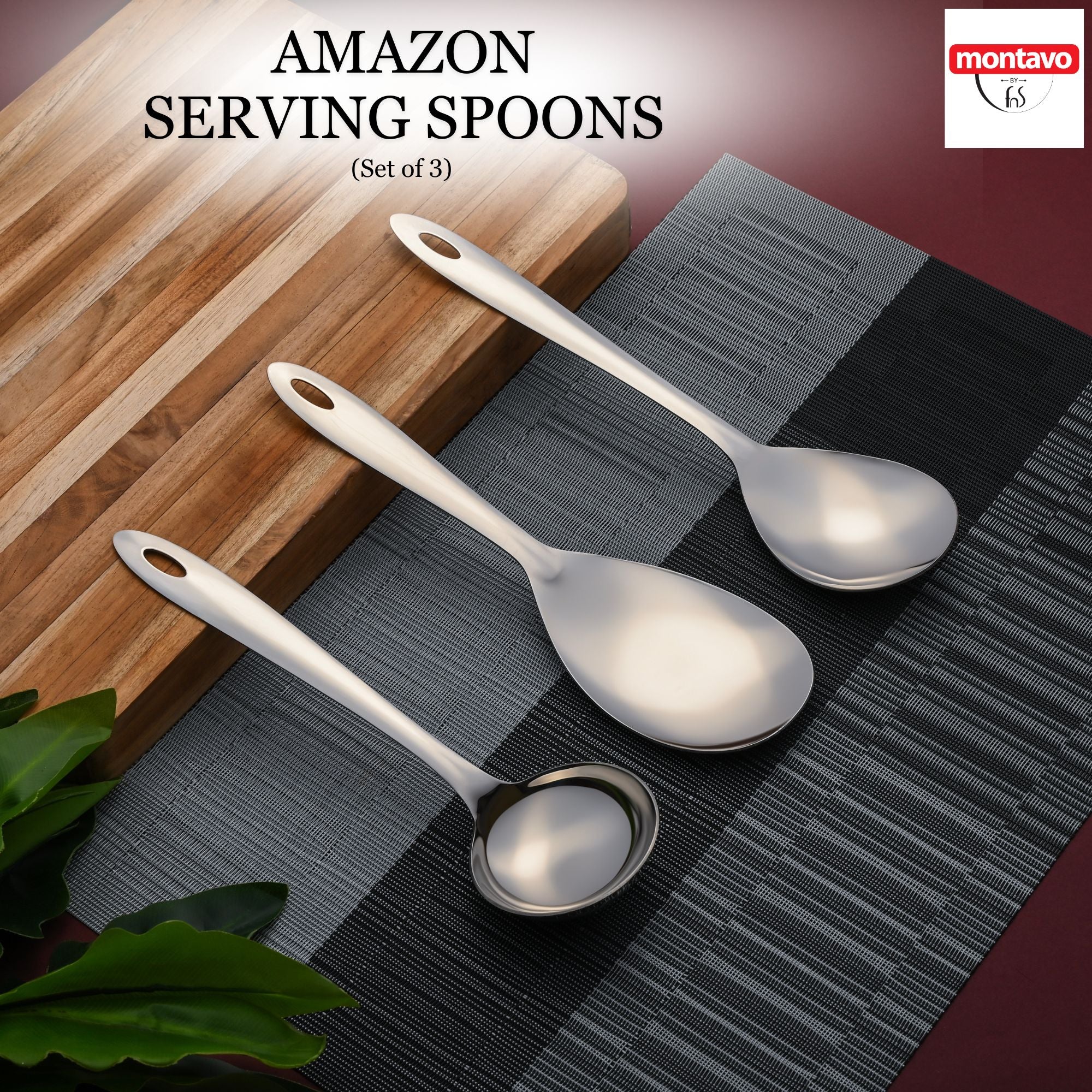 Montavo by FNS Amazon 3-piece stainless steel serving set with oval hanging holes on wooden board and gray placemat lifestyle display