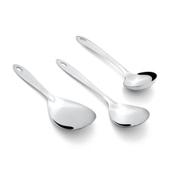 Montavo Amazon 3-piece stainless steel serving set scattered arrangement on white background showcasing rice server, veg spoon, and gravy ladle with oval handles