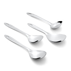 Montavo Amazon 4-piece serving spoons scattered on white background including gravy ladle, rice spoon, and two vegetable serving spoons with oval handles.