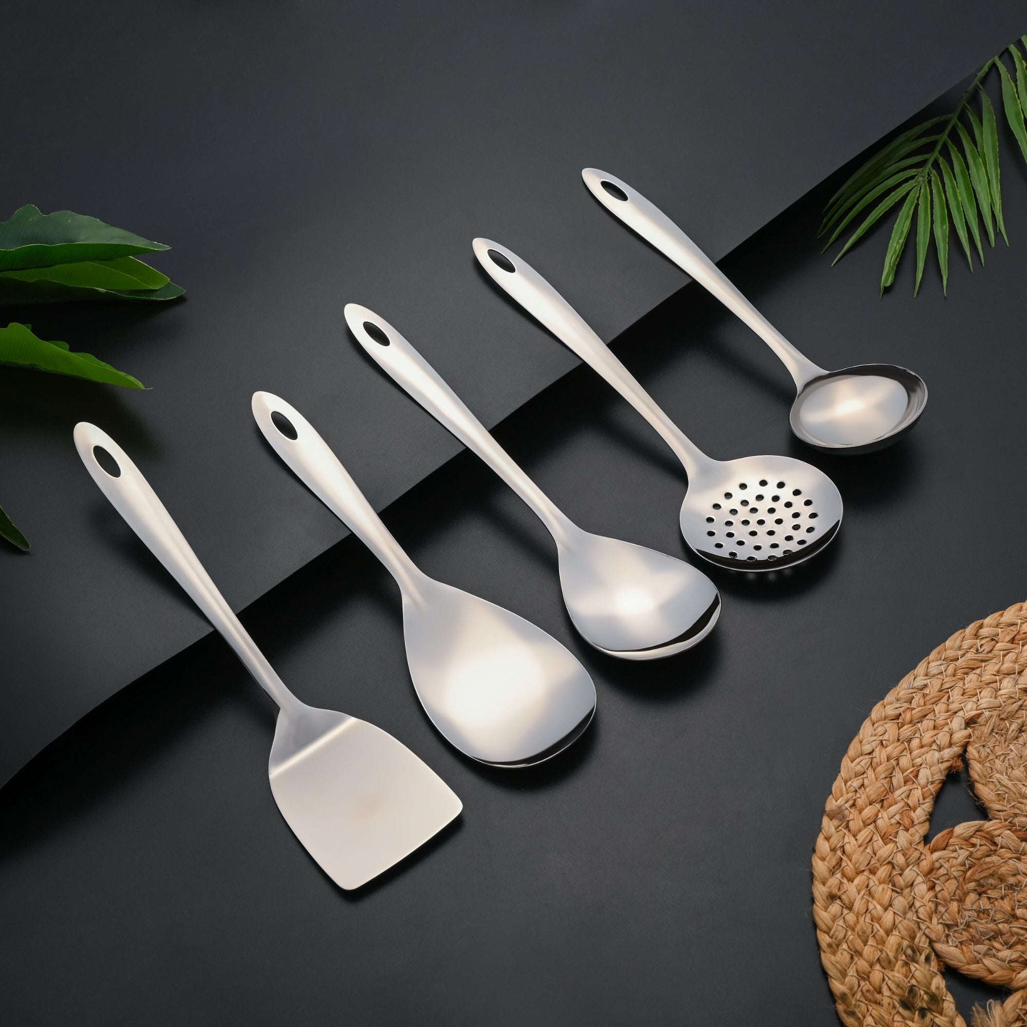 Montavo five-piece serving spoons set with white handles and stainless steel spoon heads