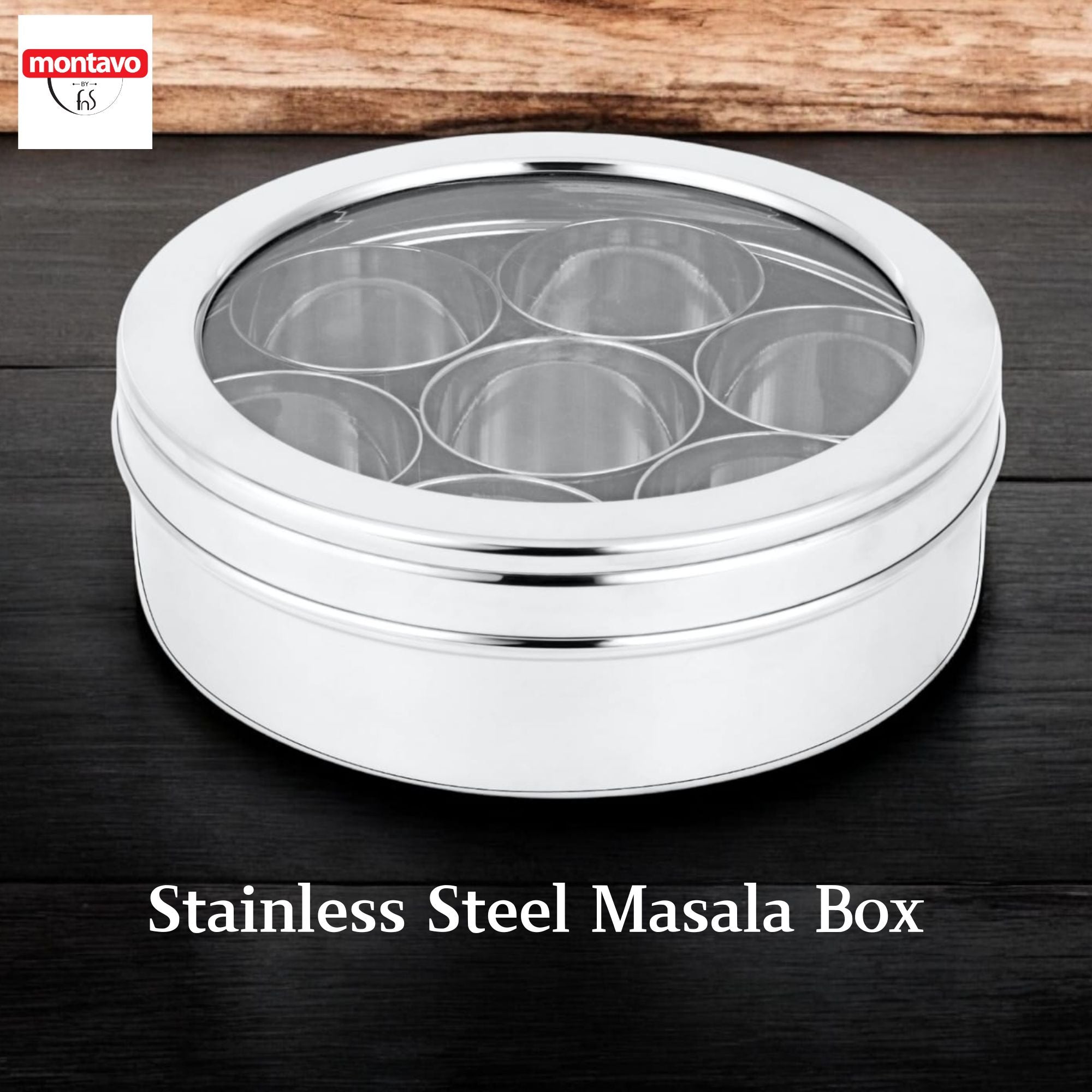 Montavo by fns stainless steel masala box with 7 inner containers and transparent see-through lid, placed on dark wooden surface