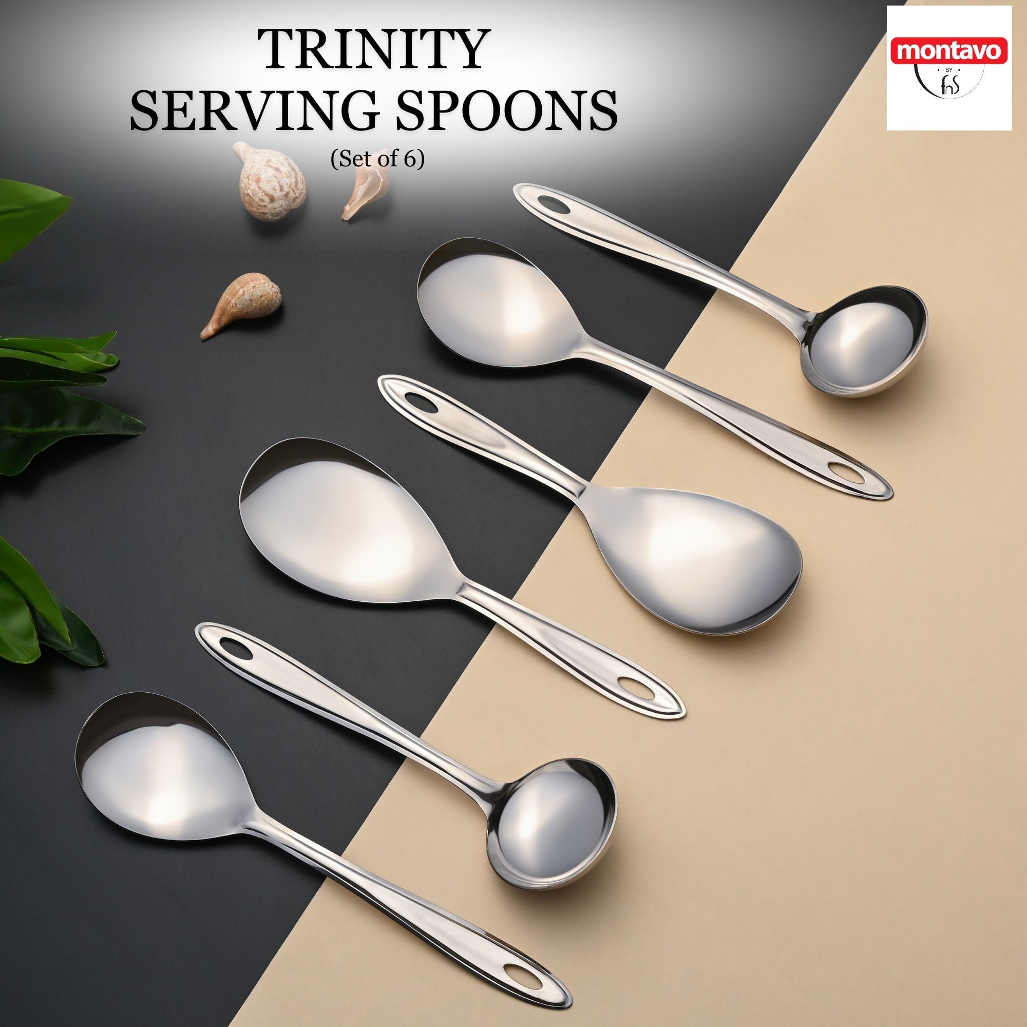 Montavo by FNS Trinity 6-piece stainless steel serving spoon set displayed diagonally on dual-tone surface with decorative shells and leaves