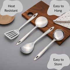 Montavo Trinity heat-resistant serving spoons with easy-to-hang storage holes displayed on wooden cutting board with polka dot napkin