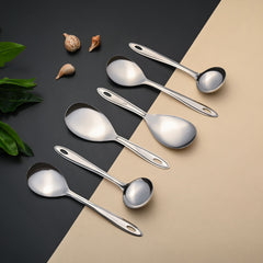 Montavo Trinity serving spoon set featuring 6 pieces arranged on black and beige background with elegant oval handle design and mirror finish