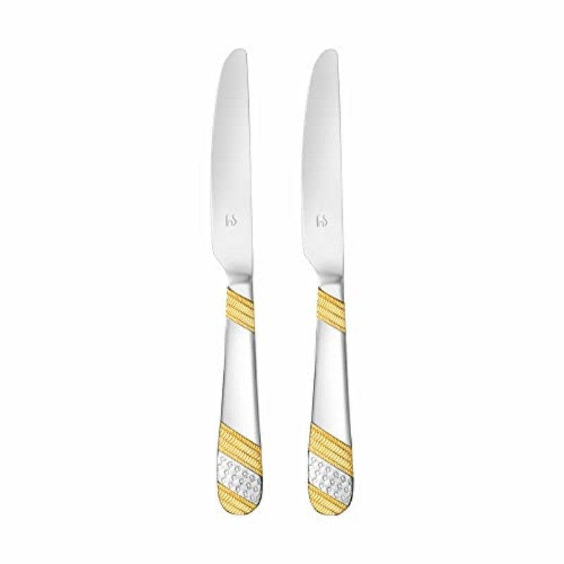 Pair of stainless steel dinner knives with mirror finish and gold-silver decorative handles standing upright on white background for product showcase.