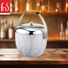 Premium marble finish ice bucket with mirror chrome lid and handle on rustic wooden bar counter with liquor bottle display in background