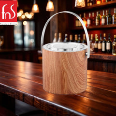 Premium wooden finish ice bucket on bar counter with blurred liquor bottles and ambient lighting in background