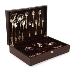 Four-piece cutlery set with gold and silver textured handles, displayed diagonally on white background.