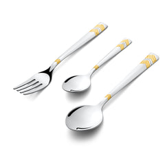 Fork and two spoons with gold-patterned handles displayed diagonally on a clean white background.