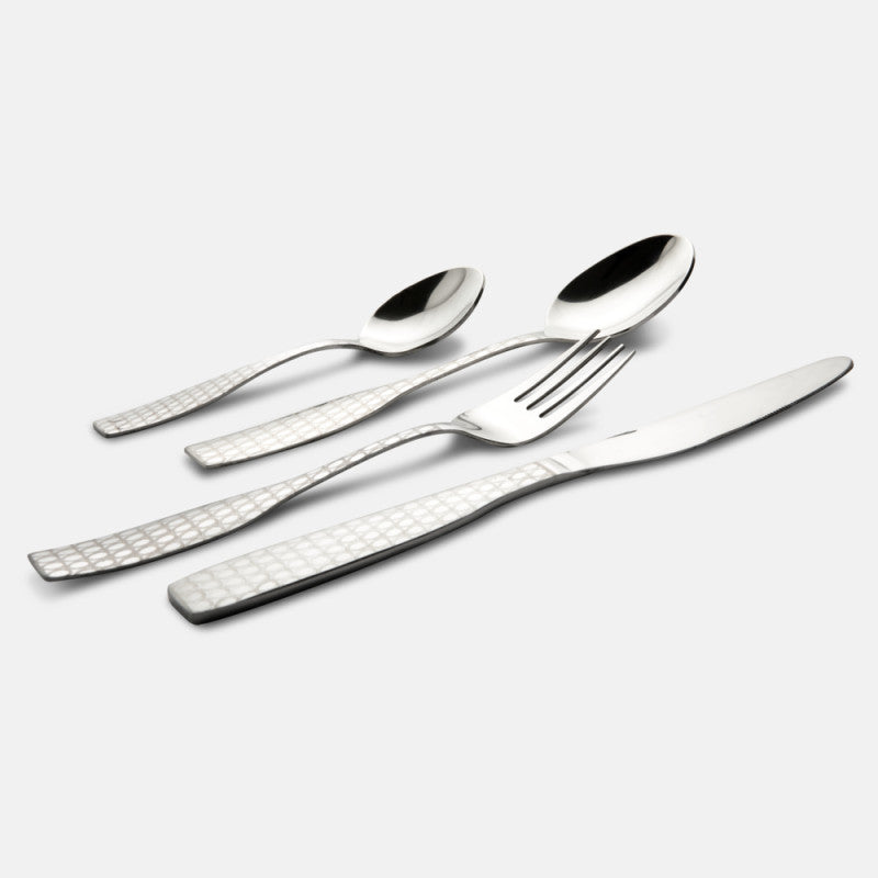Four stainless steel cutlery pieces with geometric-textured handles laid diagonally on plain white background.