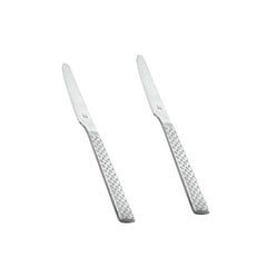 Pair of polished stainless steel Rhombo dinner knives with eye-catching geometric diamond pattern handles arranged diagonally on clean white background.