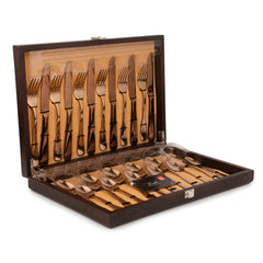 Opened luxury wooden display case with dark brown finish containing complete Rosella cutlery set with rose gold utensils arranged in cushioned slots, showing both upper and lower compartments.