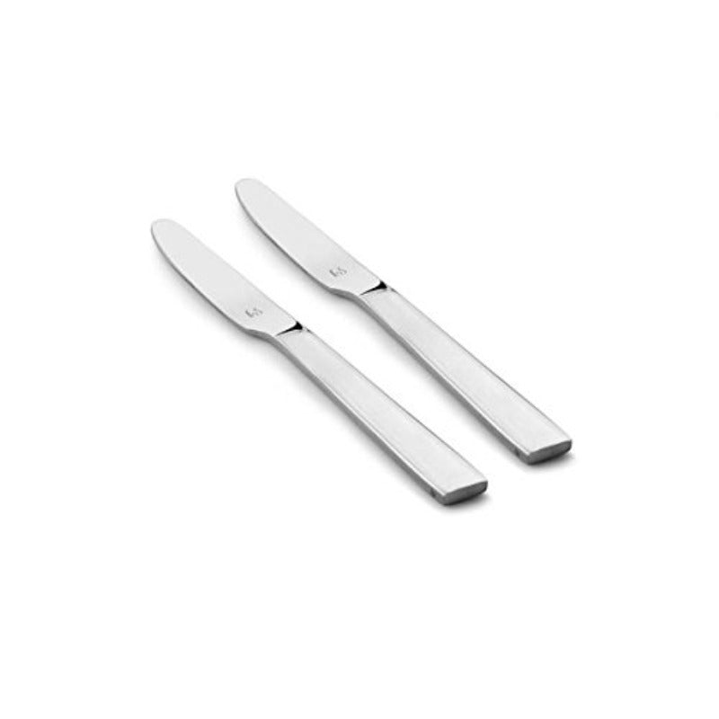 Two polished stainless steel dinner knives with sleek flat handles and branded logo, arranged diagonally on clean white background.
