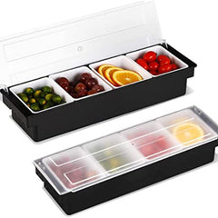 Two stackable condiment caddies with clear lids, top one filled with olives, grapes, orange slices, and cherry tomatoes, bottom one closed