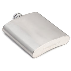 7oz stainless steel hip flask with brushed finish and engraved text, screw cap with textured grip, lying flat on white background