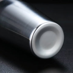 Close-up of stainless steel cocktail shaker base bottom showing smooth rounded edge and polished finish