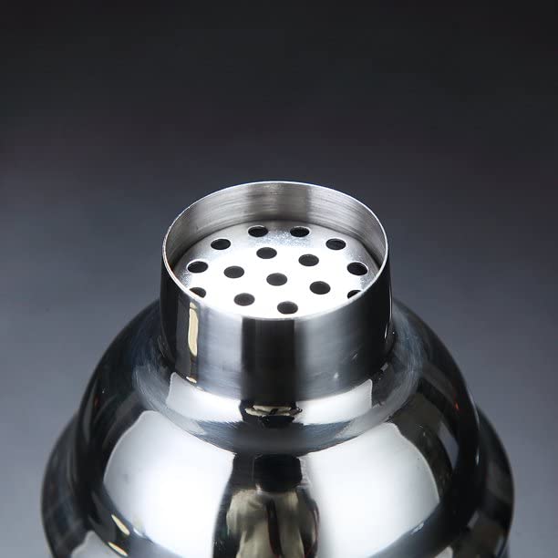 Close-up of stainless steel cocktail shaker cap showing built-in strainer with multiple holes for filtering cocktails