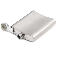 Stainless steel hip flask lying flat with removable shot cup cap showing portability and compact design
