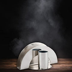 Stainless steel semicircular napkin holder with dual cylindrical toothpick holders on a wooden surface with smoky dark background