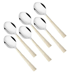 Stainless steel tea spoon set of 6 pieces with textured beige handles in diagonal arrangement on white background