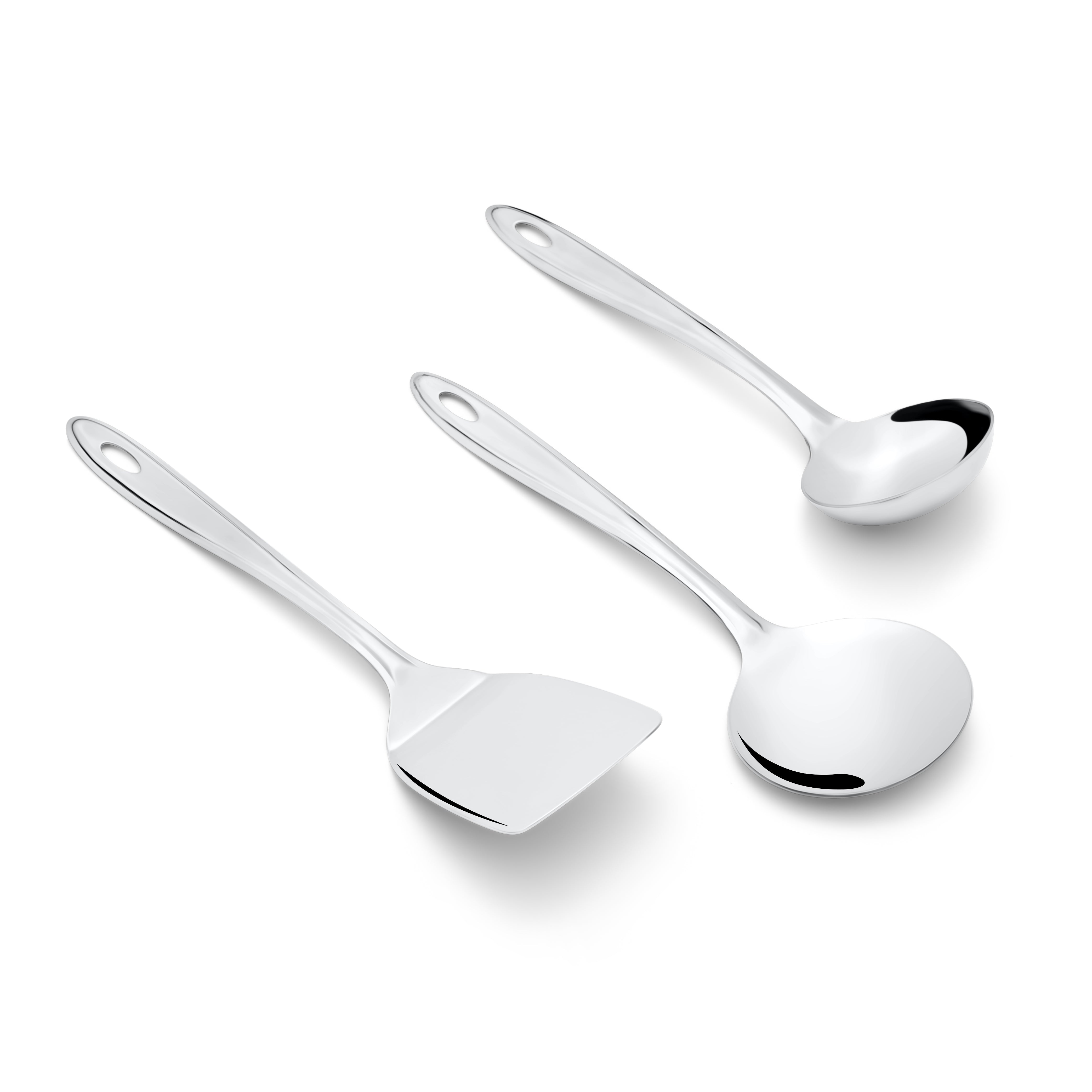 Three-piece Trinity serving utensil set with spatula, serving spoon, and ladle on white background top view