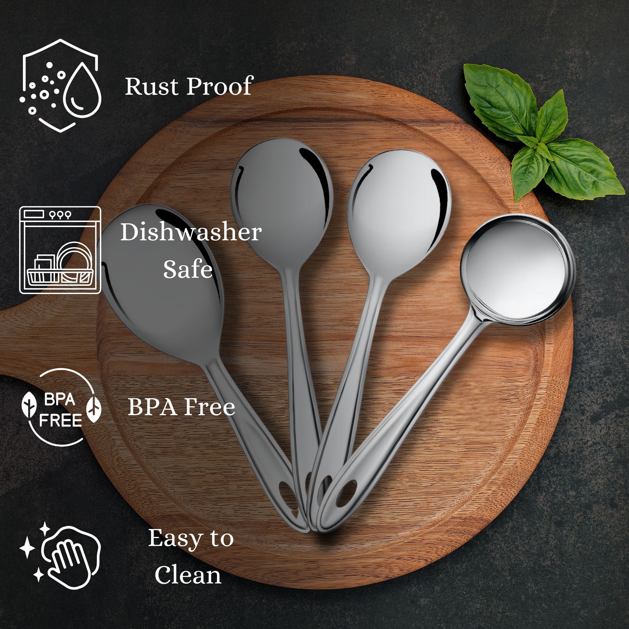 Trinity serving spoons on wooden board showcasing rust-proof, dishwasher-safe, BPA-free features with mint leaf decoration and dark background.