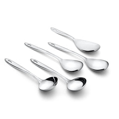 Trinity stainless steel serving spoons arranged artistically on white background showcasing mirror polish finish and modern minimalist kitchen design aesthetic.