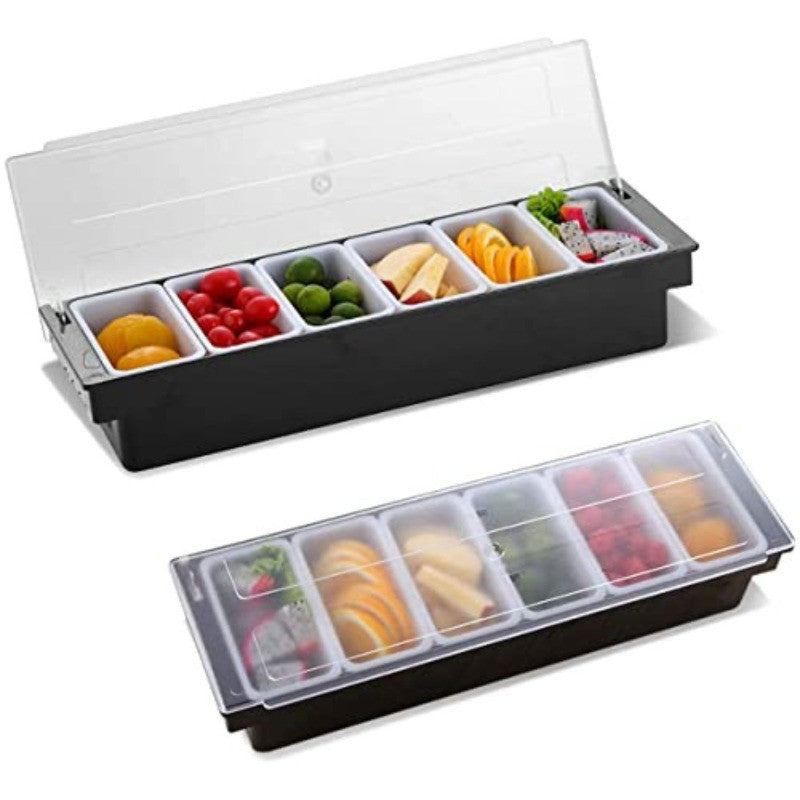 Two six-compartment condiment caddies with clear lids, one open showing kumquats, cherry tomatoes, limes, cheese, oranges, and dragon fruit, one closed below