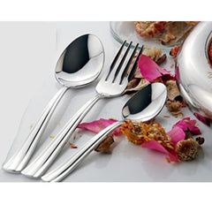 Elegant cutlery trio—spoon, fork, and teaspoon—displayed with dried flowers and petals on white.